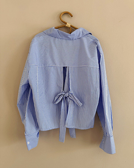 blue and white striped blouse with bow on the back